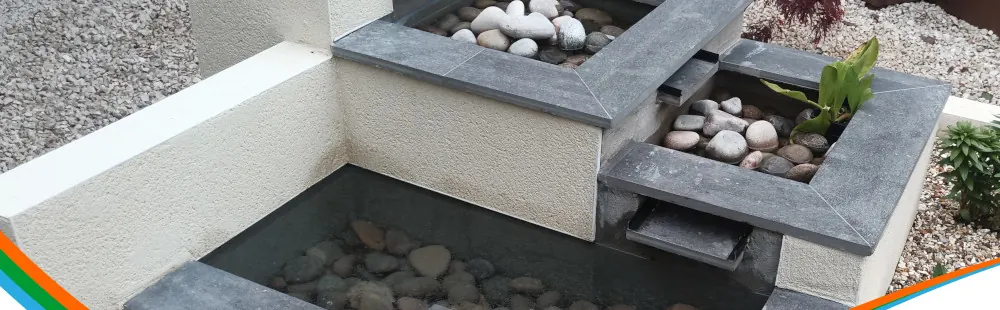 A contemporary water feature with rills and planting